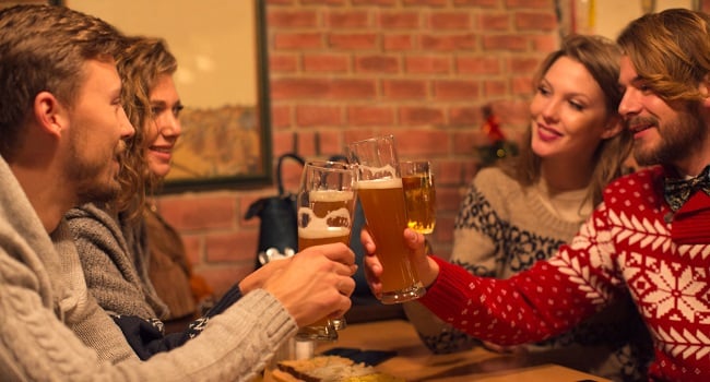 Friends having beers in restaurant.