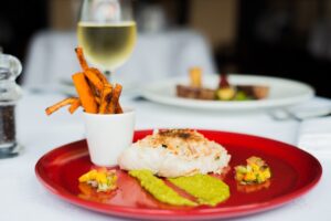 Oven Baked Hake Fillet – Crabmeat Crust, Pea Puree, Mango Salsa, Sweet Potato Fries Ice House Hotel