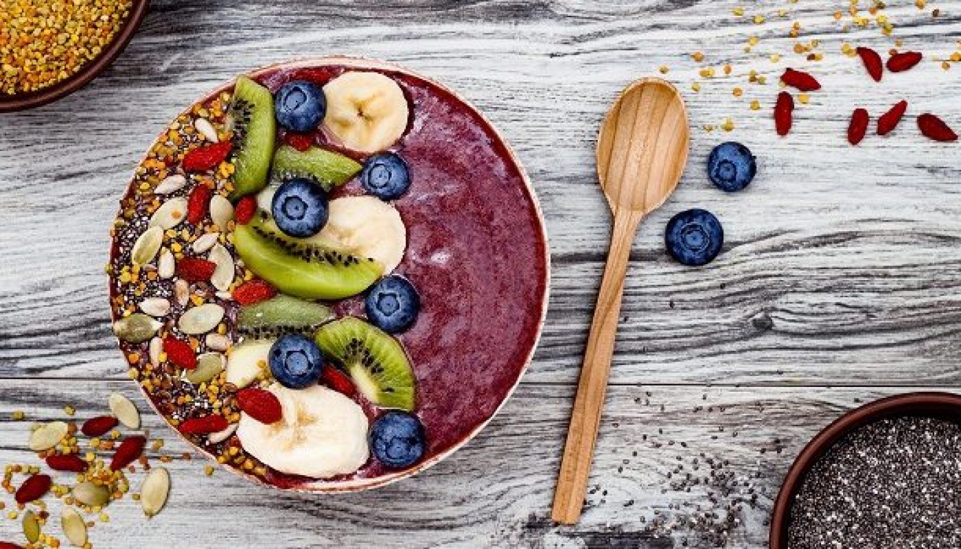 Acai bowl breakfast superfoods smoothies bowl with chia seeds, bee pollen