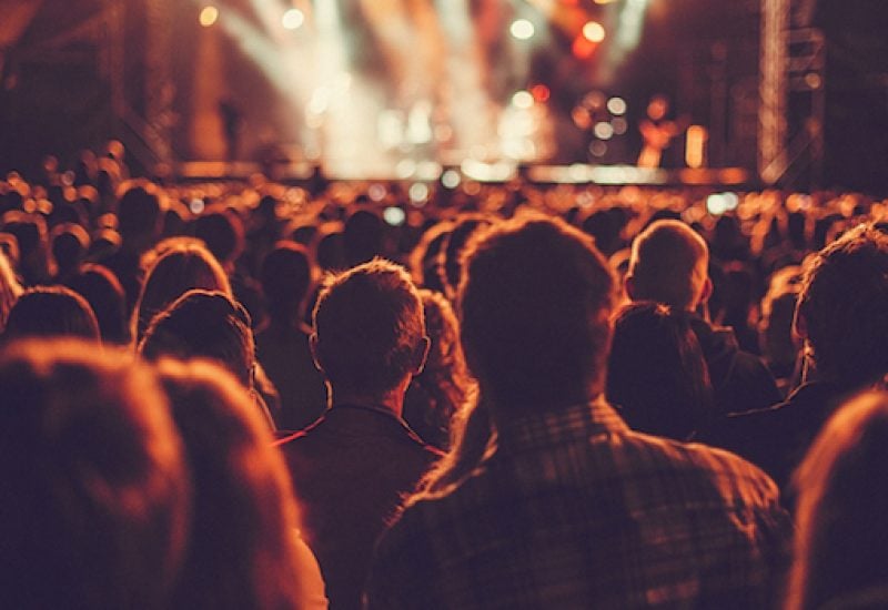 Big concert audience listening to music at festival