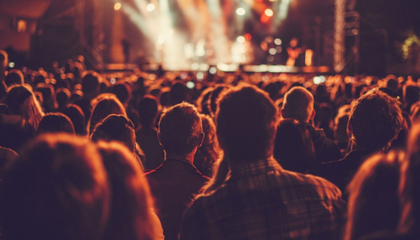 Big concert audience listening to music at festival