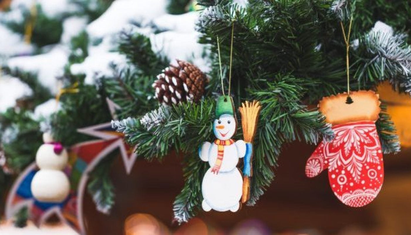 Little toy snowman in the decorations for the New Year