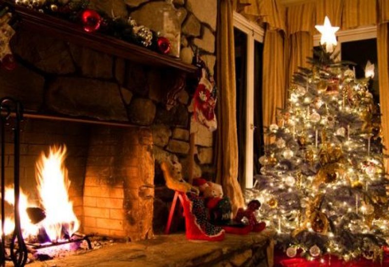 Christmas tree and stone fireplace in a vintage home