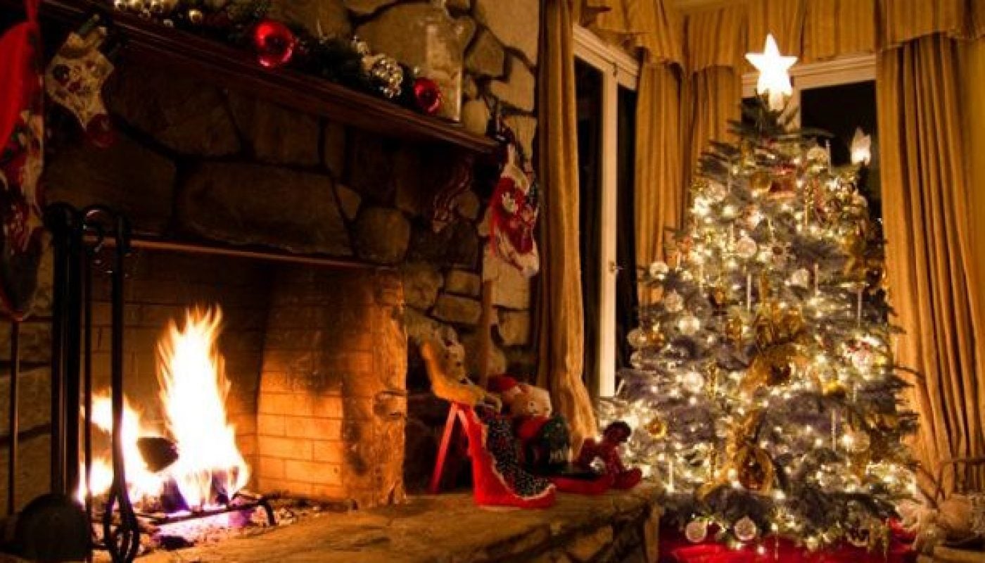 Christmas tree and stone fireplace in a vintage home