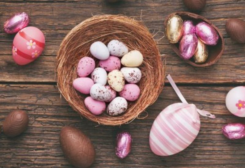 Easter Chocolate Eggs Over Rustic Wooden Background