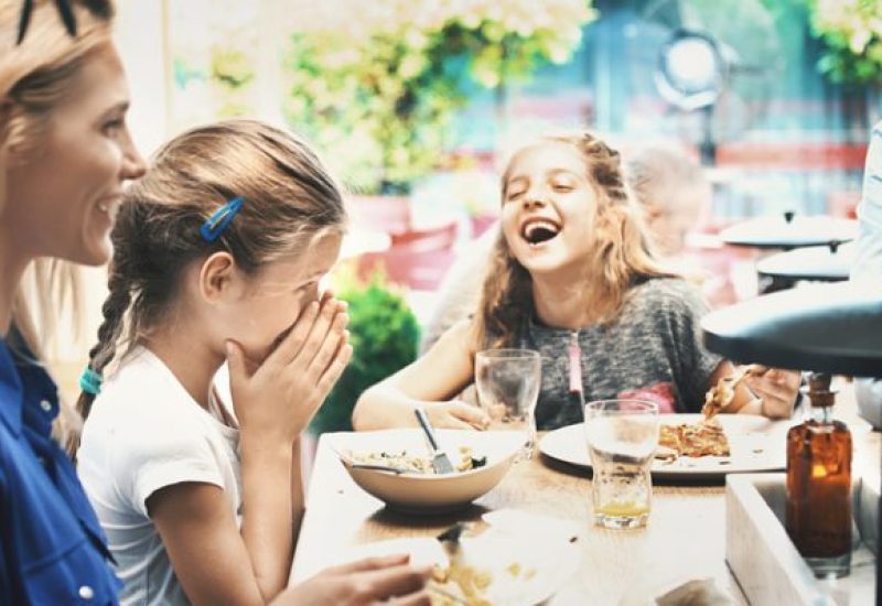 Young family having lunch at a restaurant.
